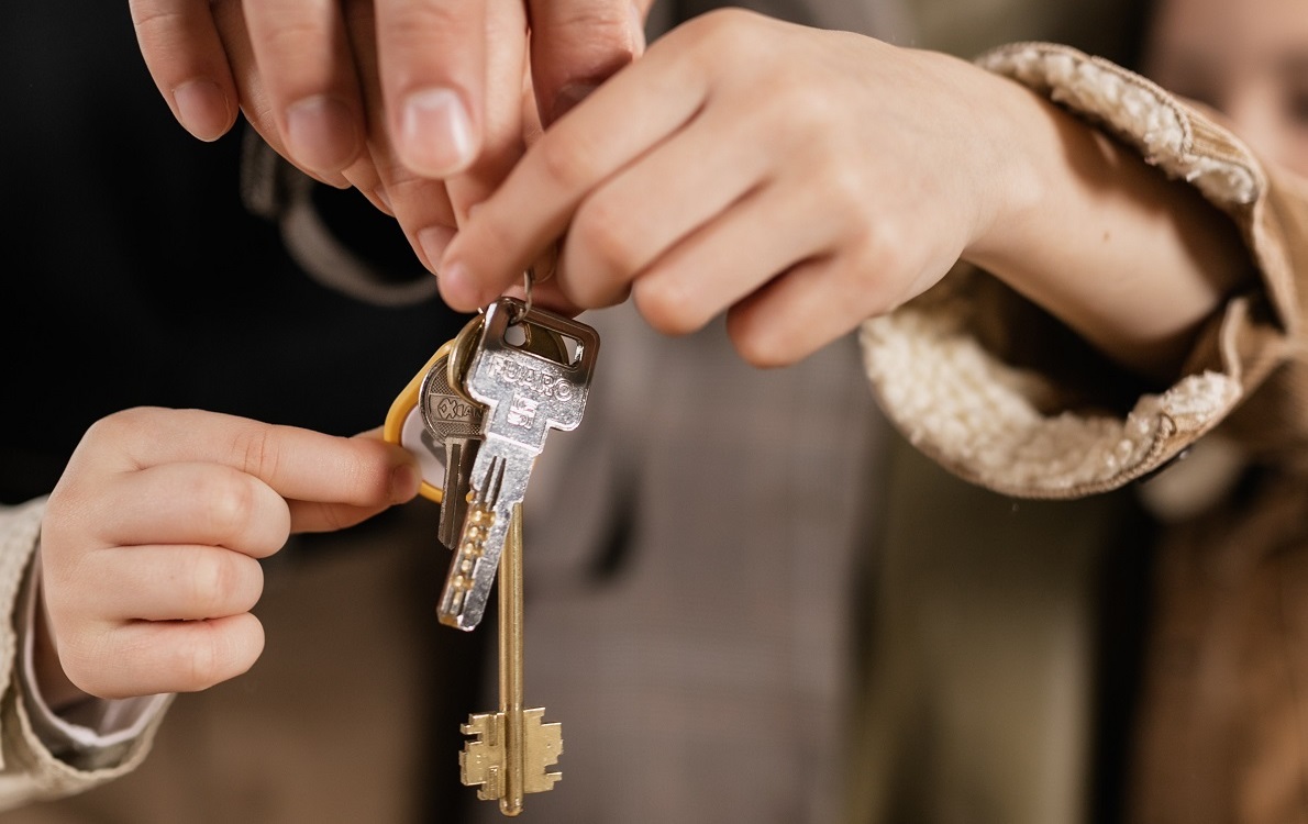 handing house keys to family